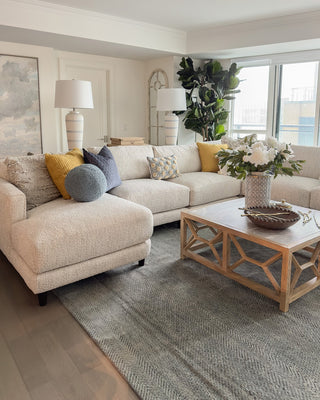 A bright living room featuring a sectional