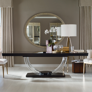 A picture of a black dining table with acrylic legs