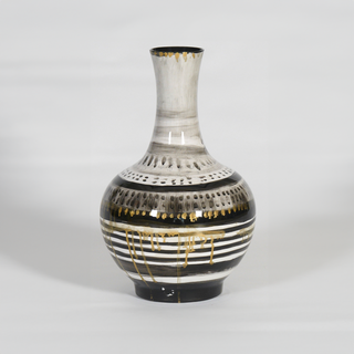 A speckled, long-neck vase.